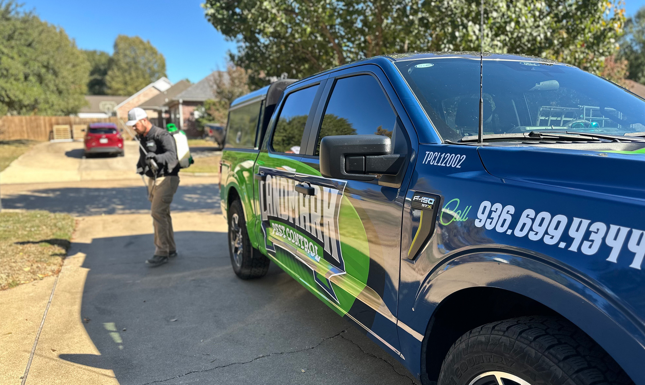 landmark-pest-control-truck-outside-house